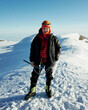 © Joel Forsman/Stocksy - a happy man on top of Mount Rainier mountain after summiting
