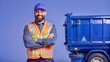 © Phonlasit - handsome garbage collector smiling next to the truck.