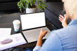 © Wavebreak Media - A young biracial woman points at a laptop screen during an business office discussion, copy space