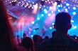 © tantawat - Dynamic Live Music Performance with Colorful Lights and Captivated Audience