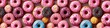 © Flash Canvas - Creative food baker bake bakery background banner panorama wallpaper, seamless pattern texture - Top view of many colorful pink sweet delicious donuts, Generative AI