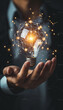 © EvgeniiasArt - Person Holding Light Bulb. Generative AI