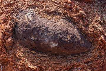 Wall Mural - Spheroidal weathering basalt， Waimea Canyon Basalt / Napali Member / Lava flows, Kauai, Hawaii. Red soil. 