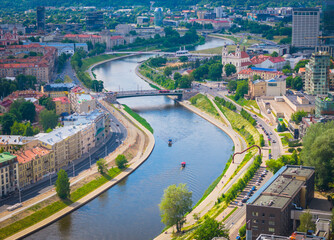 Canvas Print - Vilnius, Lithuania. Aerial view of new city center with skyscrapers. Panoramic drone photo