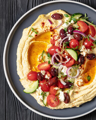 Wall Mural - Greek hummus with veggies, olives, feta on plate