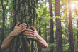 © Emanuel - Person hugging a tree in the woods, representing connection with nature