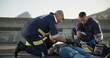 © CineLens/peopleimages.com - Paramedic, rescue and team with patient, outdoor and EKG to check heart, service and helping of person. EMS, accident and injury on street, healthcare and medical professional with victim in USA