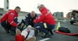 © CineLens/peopleimages.com - People, paramedic and help patient in road on scene for emergency, rescue and support. Emt team, healthcare and stretcher for injured person on accident with medical service, care and iv bag