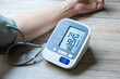 © Photo Sesaon - Man check blood pressure monitor and heart rate monitor with digital pressure gauge. Health care and Medical concept