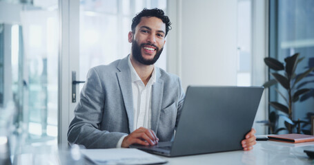 Man, laptop and portrait in boardroom with smile, documents and ready for meeting at startup company. Person, computer and happy in modern office for creativity, report or proposal with paperwork
