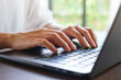 © Farknot Architect - Closeup image of a woman hands working and typing on laptop computer keyboard