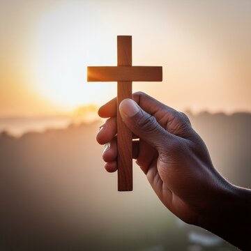Wooden Christian Cross being held by Dark Skinned Hand - Symbol of Christianity - Believe and Faith in Christ or God - Praying or Wishing - Worshipping of Religion - Asking for Blessing from Above