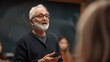 © tashechka - An elderly professor passionately teaches in a classroom, engaging with students and sharing his knowledge and wisdom.