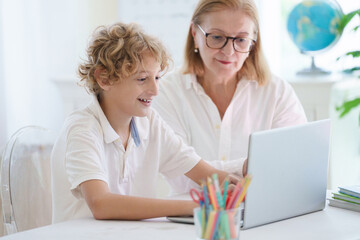 Wall Mural - Child in school. Student in class. Boy at homework