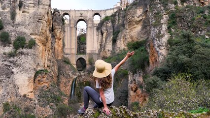 Wall Mural - Happy woman tourist in Ronda. Famous andalusian city in Spain