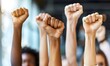 © simba kim - Close up of multiethnic people's hands raising fists in the air, Generative AI