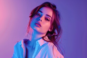 Wall Mural - Fashion model in cotton shirt poses in neon light.