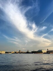 Wall Mural - city river view, river in the city center, blue sky, white clouds, summer