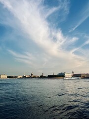 Wall Mural - city river view, river in the city center, blue sky, white clouds, summer