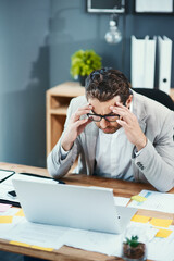 Laptop, glasses and businessman with pain in office for tension, headache and anxiety in finance job. Top view, broker and frustrated with stress by tech for investment, mistake or stock market crash