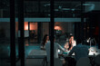 © Reese Coop/peopleimages.com - Collaboration, corporate team and office at night for deadline, strategy and ideas with laptop. Female leader, staff and together at workshop for learning, goal or development in workplace in evening