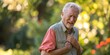 © Iryna - Cheerful senior man in the park, enjoying nature and leisure, embodying health and active lifestyle.