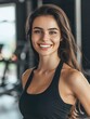© PSCL RDL - happy attractive sporty fit young woman on blurry gym background, fitness and health concept, sport banner with copy space