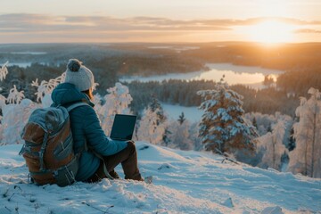 Wall Mural - Person Working on Laptop in Snowy Winter Landscape With Frozen Lake