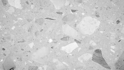 Poster - A black and white photo of a stone floor with many small stones. The photo has a very simple and minimalistic feel to it