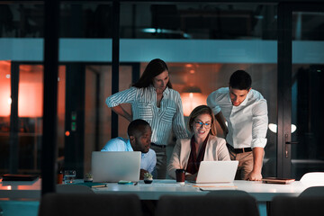 Fototapete - Team, laptop and business people in office at night with stock market charts for corporate investment. Discussion, computer and financial advisors working on company profit report with deadline.