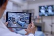 © Ilia Nesolenyi - A medical professional views an augmented reality simulation of a surgical procedure on a tablet