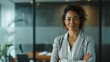 © standret - Confident businesswoman smiling in modern office environment