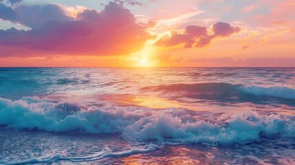 Wall Mural - a stunning sunset illuminates a white wave crashing against the shore, as the orange and blue sky sets in the background
