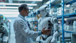 © Jirawatfoto - Innovative Robotics: Scientist and Robot Engaging in AI Research Dialogue in Laboratory Setting
