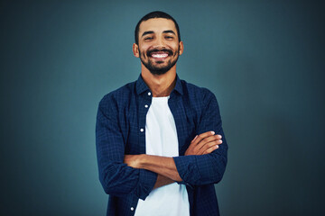 Sticker - Arms crossed, designer or portrait of happy man with fashion, pride and confidence in studio. Trendy model, male person or entrepreneur with smile, mockup space or style isolated on dark background