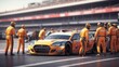 © yendisupiandi - Professional pit crew ready for action as their team's race car arrives in the pit lane during a pitstop of a car race, concept of ultimate teamwork