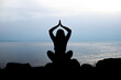 © Наталья Николаева - yoga poses. silhouette of a girl in a yoga pose against the background of the sea and sky
