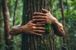 © Vlad - Love Nature. Nature Lover Embracing Tree Trunk in Tropical Forest with Green Musk. Concept of Environmental Activist Protecting Nature from Deforestation and Climate Change