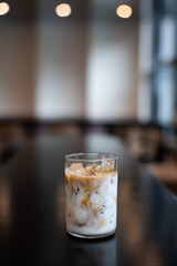 Wall Mural - glass of coffee with milk on the table