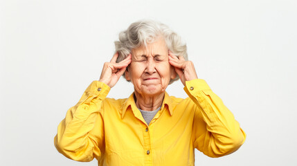 Wall Mural - Happy elderly woman in a yellow shirt, covering her ears with both index fingers