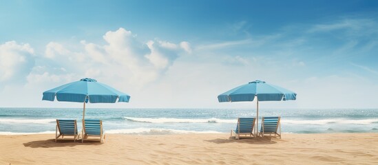 Wall Mural - Sun protective umbrellas on an empty beach in the morning. Creative banner. Copyspace image