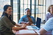 © A.S./peopleimages.com - Meeting, teamwork and business people with tech for planning strategy and project research with documents. Brainstorming notes, staff collaboration and laptop for information in creative agency