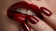 © Kingboy - Close-up of glossy red lips and manicured nails