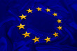 © kittyfly - flag European Union on beautiful silk background, concept of politics, global business, trading, international cooperation, copy space, template