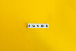 © photoopus - Word Funds. Collective Investments. Text on Block Letter Tiles on Yellow Background. Minimalist Aesthetics.