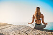 © peopleimages.com - Beach, back and woman with meditation for yoga, wellness and spiritual peace in California. Zen, female yogi and hands with lotus pose for chakra, relax and mental health by mockup space outdoor