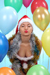 © zhagunov_a - Beautiful young woman in Santa Claus clothes