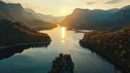 Wall Mural - High angle aerial shot of stunning lake with mountain forest scenery at sunset or sunrise