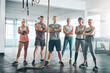 © DoneDeal/peopleimages.com - Rope, portrait and group of athletes in gym for health, wellness and body workout challenge. Fitness class, friends and team of people with personal trainer for exercise together in sports center.