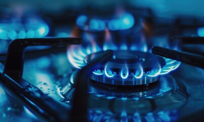 Wall Mural - Close-up shot highlighting the vibrant blue flame of a gas stove burner